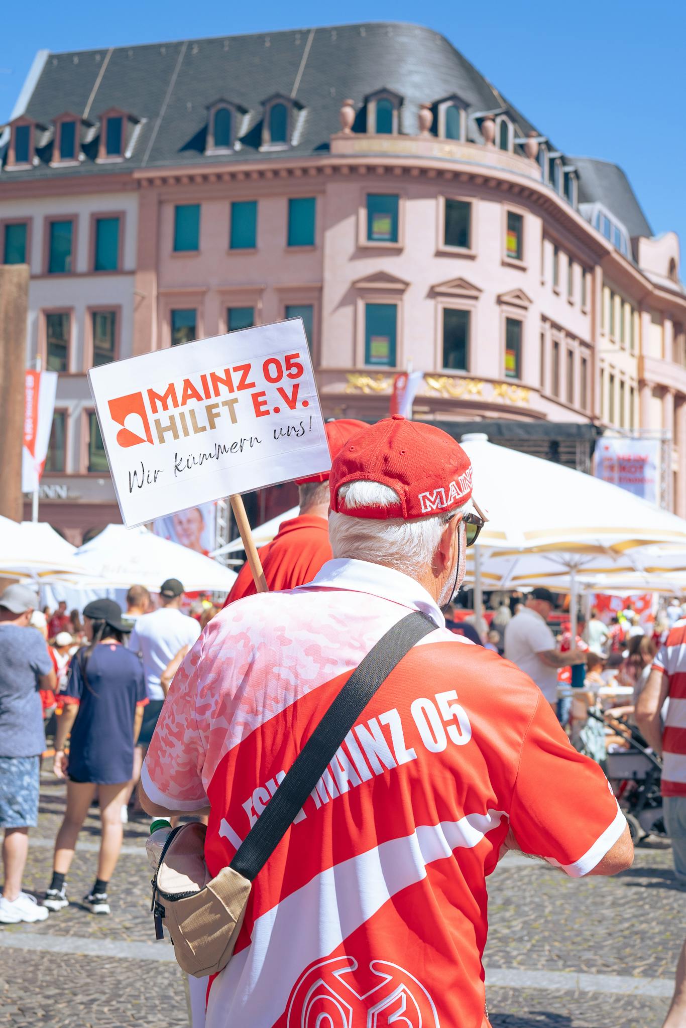 Mainz 05 fans gathered at a street festival in Mainz, Germany. Vibrant celebration in the city's central square.